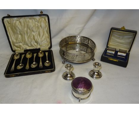 Five silver Teaspoons, a silver circular Cruet Frame, a pair of miniature Dressing Table Candlesticks, and a silver and ename