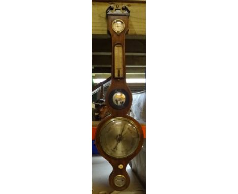 A 19th Century Wheel Barometer with hydrometer, thermometer, convex mirror and spirit level with 8" (20cms) diameter dial. 