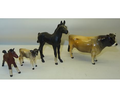 A Beswick Model of a Jersey Bull, no. 1422; a Jersey Calf, Beswick matt black Foal, and one other foal.