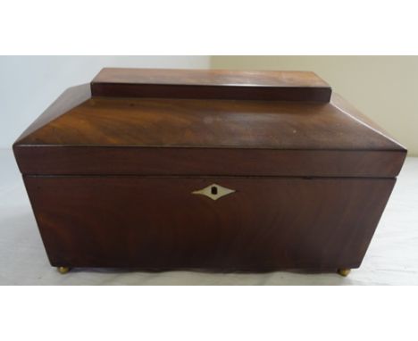 A 19th Century mahogany sarcophagus Tea Caddy with two covered containers and glass bowl.  12" (31cms) wide. 