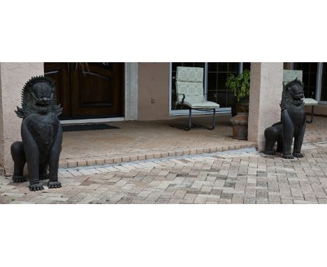 Large Pair of Antique Bronze Tibetan Foo Lions.Dimensions: 38  x 18 in. (each)- This item is currently being stored offsite a