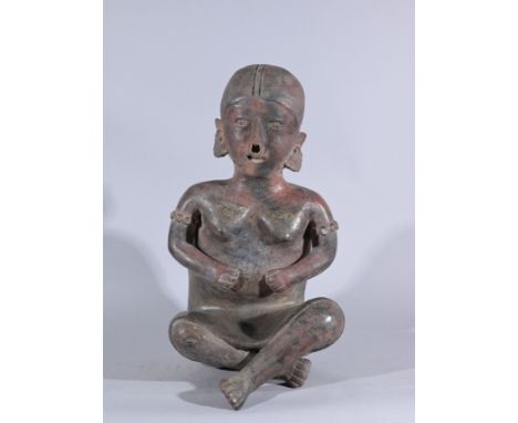 Large Pre-Columbian Seated Male FigureHeight: 21 in.  - Provenance: this item comes from the private collection of Lou A. and