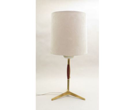 A 1960's brass and teak table lamp with later suede effect shade 