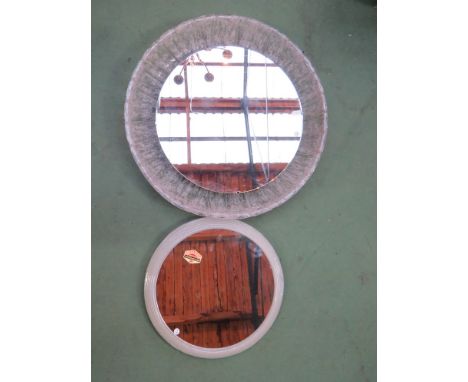 A circular wall hanging mirror light and one other 