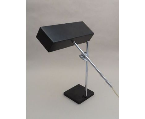An adjustable chrome and black metal desk lamp of rectangular form 