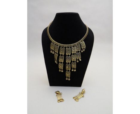A 1960's/70's gold coloured bib necklace and earring set 