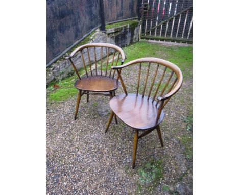 A pair of Ercol "Cow horn" backed dining chairs 