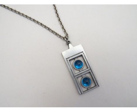 A 1969 Swedish pendant with blue circular drops on metal surround 