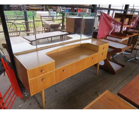 A light oak dressing table with five drawers and triple mirror 