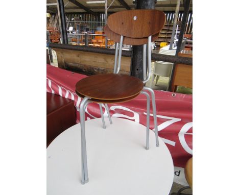 A set of four wooden stools on plastic legs, two matching chairs and a similar stool 