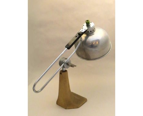 A 1940's articulated desk lamp with an aluminium shade 