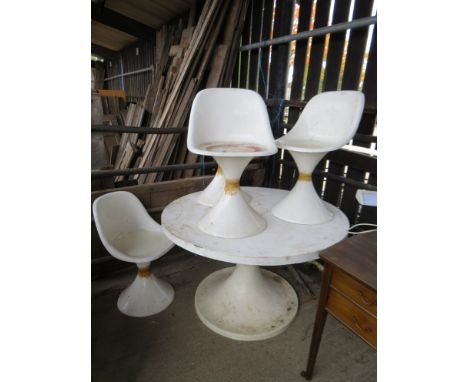 A 1960's white fibreglass garden table and matching set of four chairs with tulip feet 