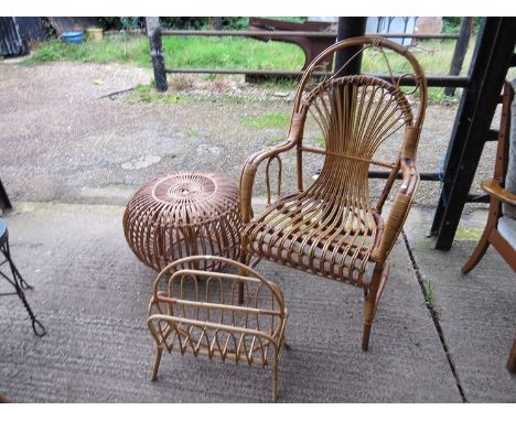A cane conservatory chair, "lobster pot" foot stool and magazine rack 