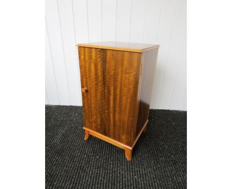 A 1950's figured walnut cabinet labelled 'Maple quality' 