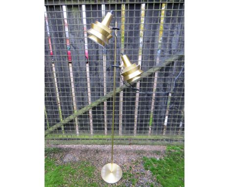 A twin head spot light in brassed finish 