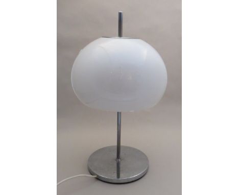 A Guzzini style table lamp with white mushroom shade, chromed base