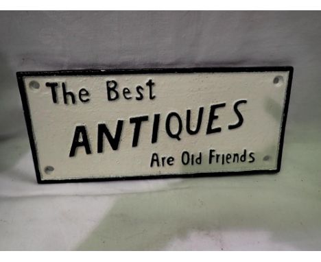 Cast iron Best Antiques Are Old Friends sign. L: 25 cm.UK P&amp;P Group 2 (£20+VAT for the first lot and £4+VAT for subsequen