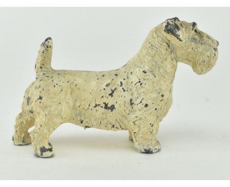 An early 20th century cold painted spelter terrier dog paperweight. The dog with holes to its feet, implying it was previousl