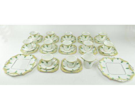 Sampson Smith Ltd. - Longton - a mid 20th century tea service. The lot comprising twelve teacups, twelve saucers, twelve side