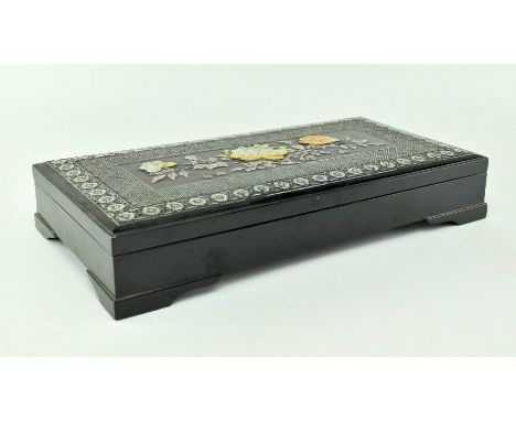 A mid 20th century ebonised box with intricate mother of pearl decoration. The box rectangular in form, the lid designed with