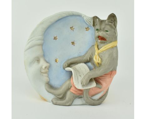 A mid 20th century bisque porcelain children's decorative nightlight / tealight holder. The vase depicting a cat sat on a cre