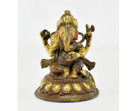 An early 20th century cold painted bronze figure depicting Hindu god Ganesh. The deity seated and with hand raised, other han