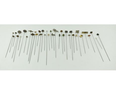 A collection of early 20th century Edwardian &amp; later silver coloured metal ladies hatpins. The lot to include pins with h