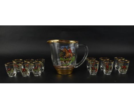 A vintage mid 20th century glass jug / pitcher and twelve matched shot / sherry glasses. Each hand painted with hunting scene