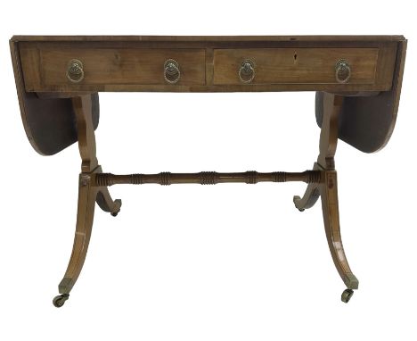 Regency mahogany sofa table, rectangular crossbanded top with twin drop-leaf ends, fitted with single drawer and one faux dra