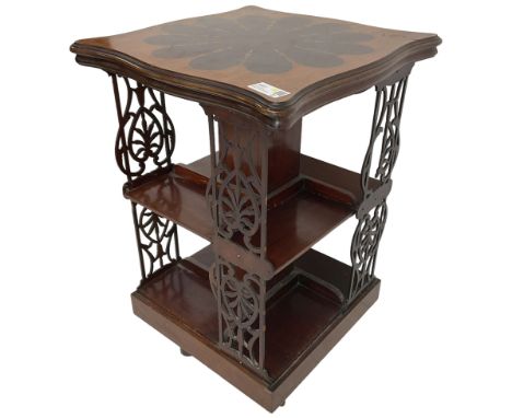 Edwardian mahogany revolving bookcase, the shaped moulded top inlaid with cusped panel and trailing bellflowers within a sati