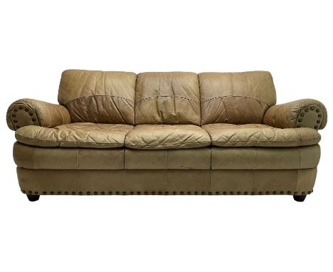 Large three-seat sofa upholstered in stitched brown leather with stud work decoration, rolled back and armsDimensions: Height