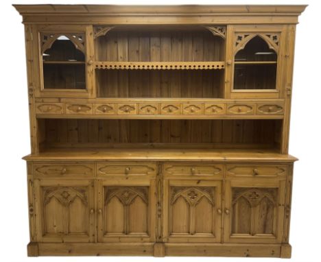 Ecclesiastical Gothic design waxed pine 8’ dresser, projecting cornice over two display cabinets, central shelf and ten small