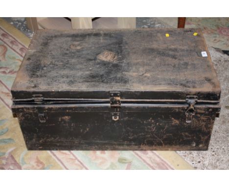 A LARGE BLACK PAINTED TIN TRUNK