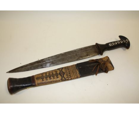 A VINTAGE TRIBAL STYLE DAGGER IN WOVEN LEATHER SHEATH