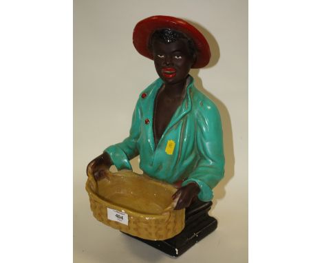 A VINTAGE CHALK FIGURE OF A WOMAN WITH A BASKET 