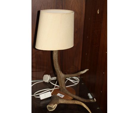 AN ANTLER CONVERTED TO A LAMP