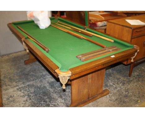 AN ANTIQUE OAK FRAMED 'EF RILEY ' SNOOKER TABLE / DINING TABLE WITH TWO LEAVES, CUES, BALLS AND SCOREBOARD, HEIGHT ADJUSTABLE