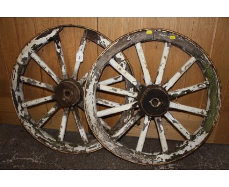 A PAIR OF VINTAGE WOODEN AND METAL BANDED WHEELS A/F