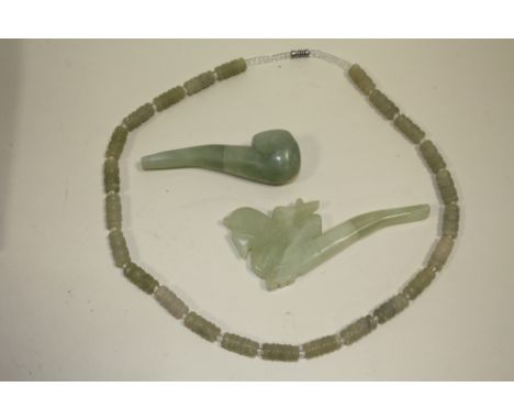 A CARVED JADE TYPE NECKLACE TOGETHER WITH TWO JADE TYPE PIPE