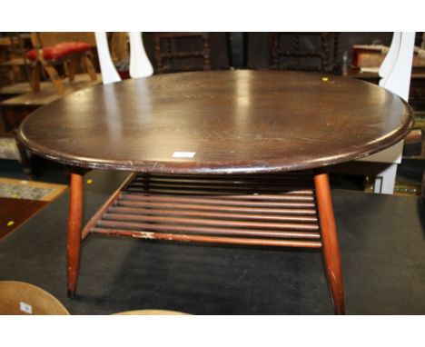 A DARK OAK ERCOL OVAL COFFEE TABLE