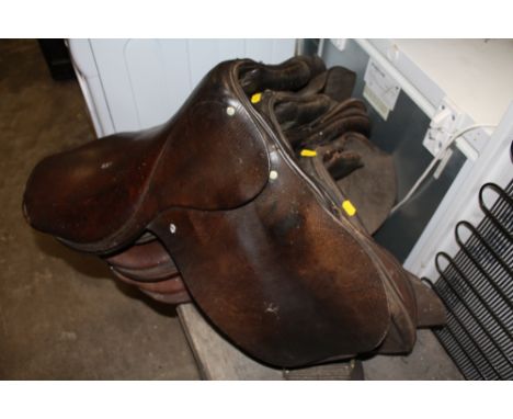 FOUR VINTAGE HORSE SADDLES