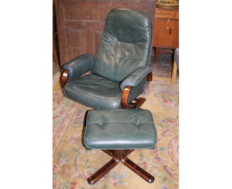 A VINTAGE DANISH UNICO LEATHER RECLINER / SWIVEL ARMCHAIR AND FOOTSTOOL (2)