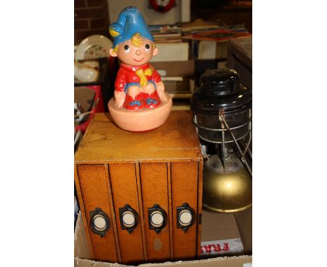 A DESKTOP LEATHERETTE CHEST OF FOUR DRAWS TOGETHER WITH A TILLY LAMP AND A VINTAGE NODDY TOY