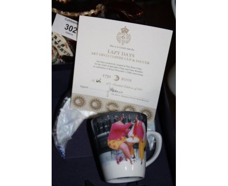 A BOXED ROYAL WORCESTER LIMITED EDITION 'LAZY DAYS ART DECO COFFEE CUP AND SAUCER' 65/500 WITH CERTIFICATE 