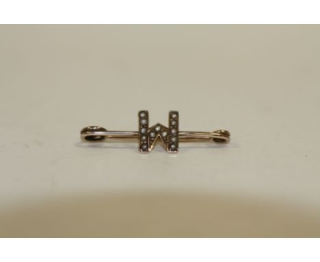 AN ANTIQUE 9 CARAT GOLD SEED PEARL M OR W STOCK PIN TYPE BROOCH