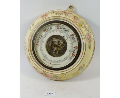 An Edwardian floral pottery framed aneroid barometer 28cm diameter 