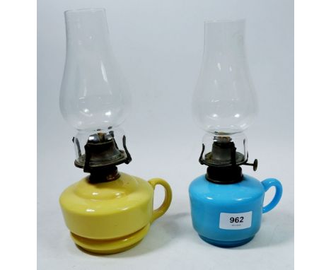 A Victorian yellow opaque glass finger lamp and a blue one 