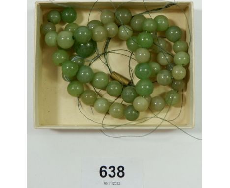 A string of jade beads - need restringing 