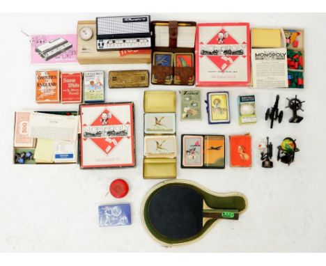 A box of collectables including various playing cards, a Stylophone etc 