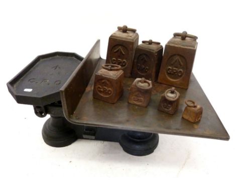 A set of cast iron and copper military GPO postal scales with broad arrow mark and set of seven weights 